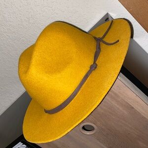 Dark yellow wide rimmed felt hat